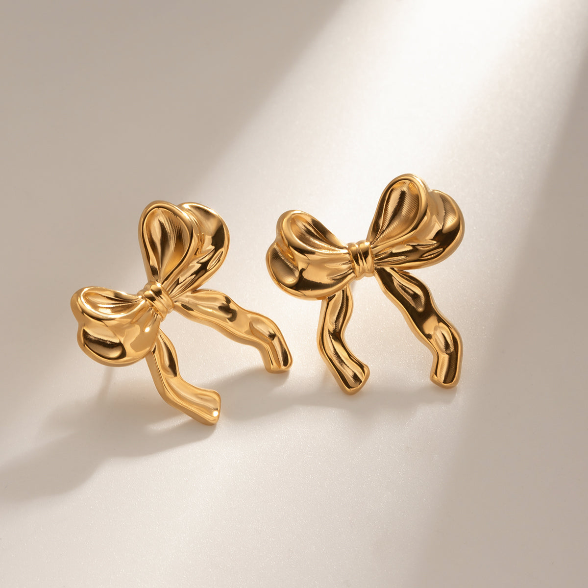 Amia Bow Studs Premium Earrings - 18K Gold Plated